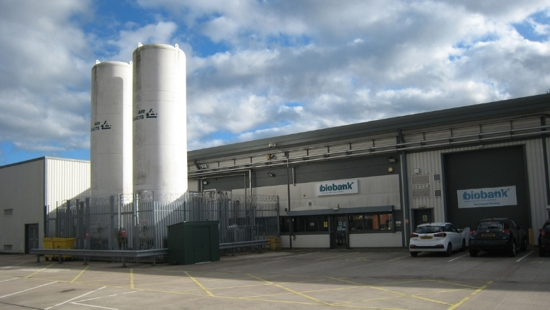 Biobank facility building with storage tanks and laboratory signage
